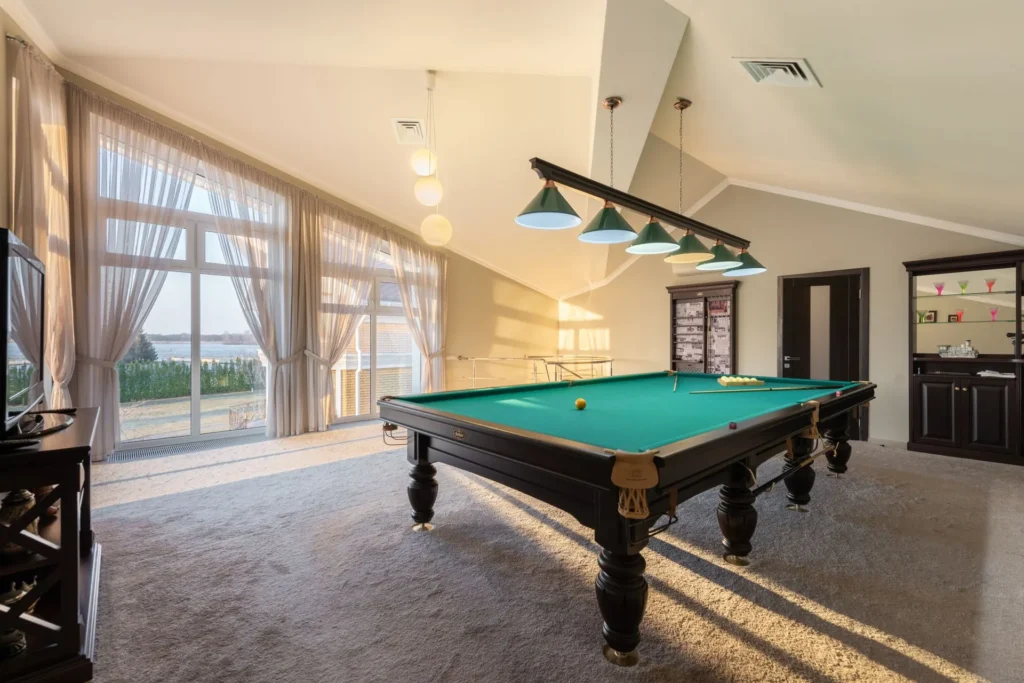 Vacation home game room with a billiards table