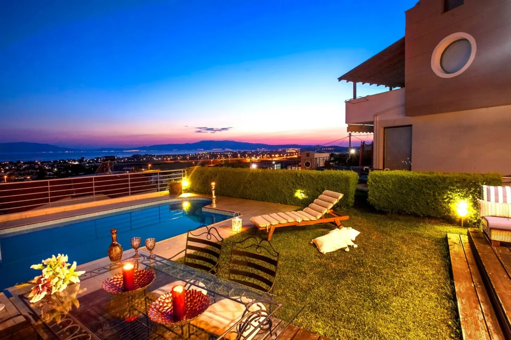 Vacation home terrace and pool at sunset